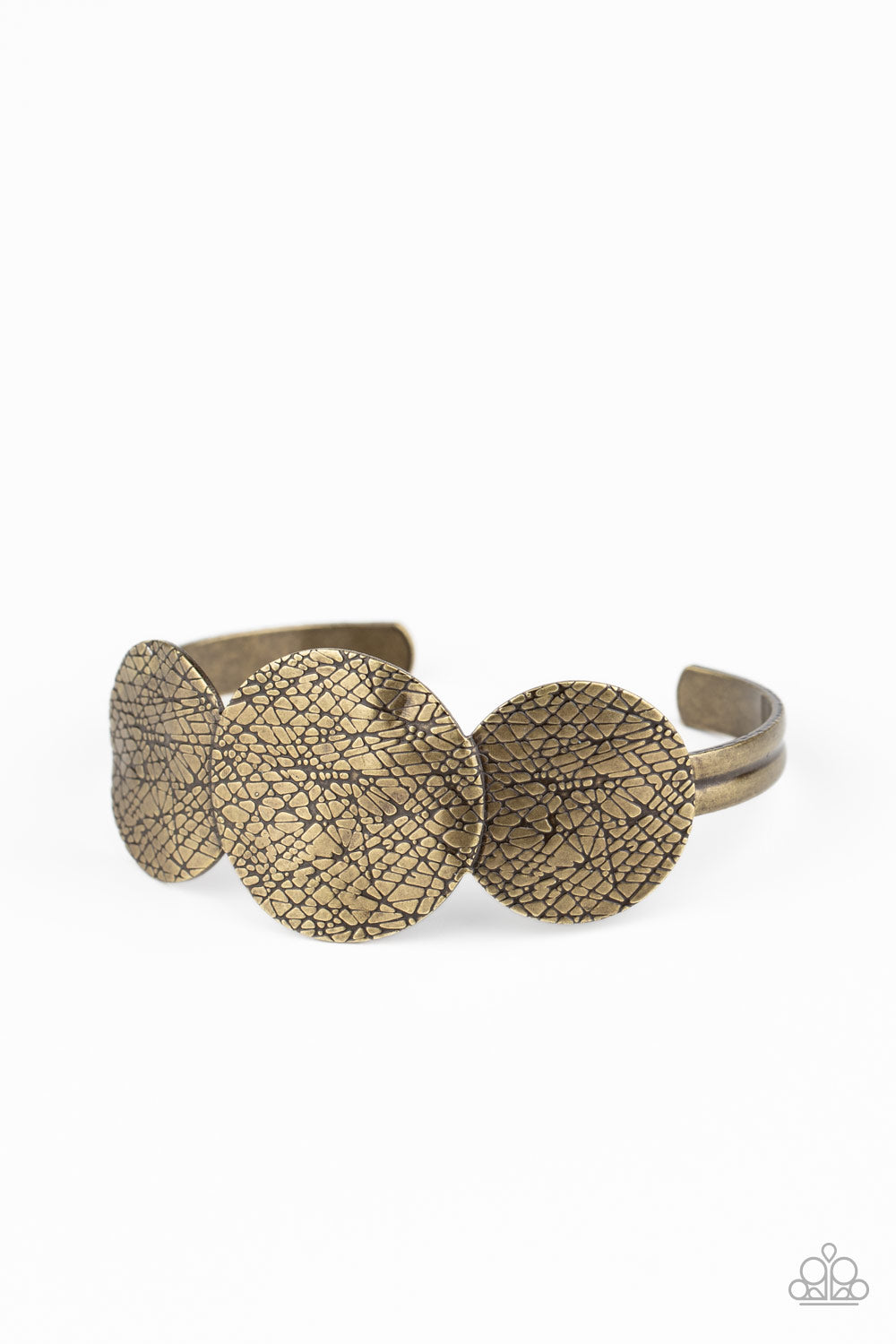 Three brass discs etched in flawless texture and delicately hammered in ripples sit atop an open brass cuff, creating a bold accent piece. Sold as one individual bracelet.