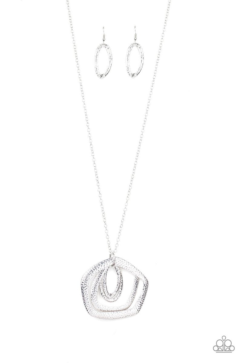 A collection of hammered geometric frames swing from the bottom of a lengthened silver chain, creating a bold artisan inspired pendant. Features an adjustable clasp closure. Sold as one individual necklace. Includes one pair of matching earrings.