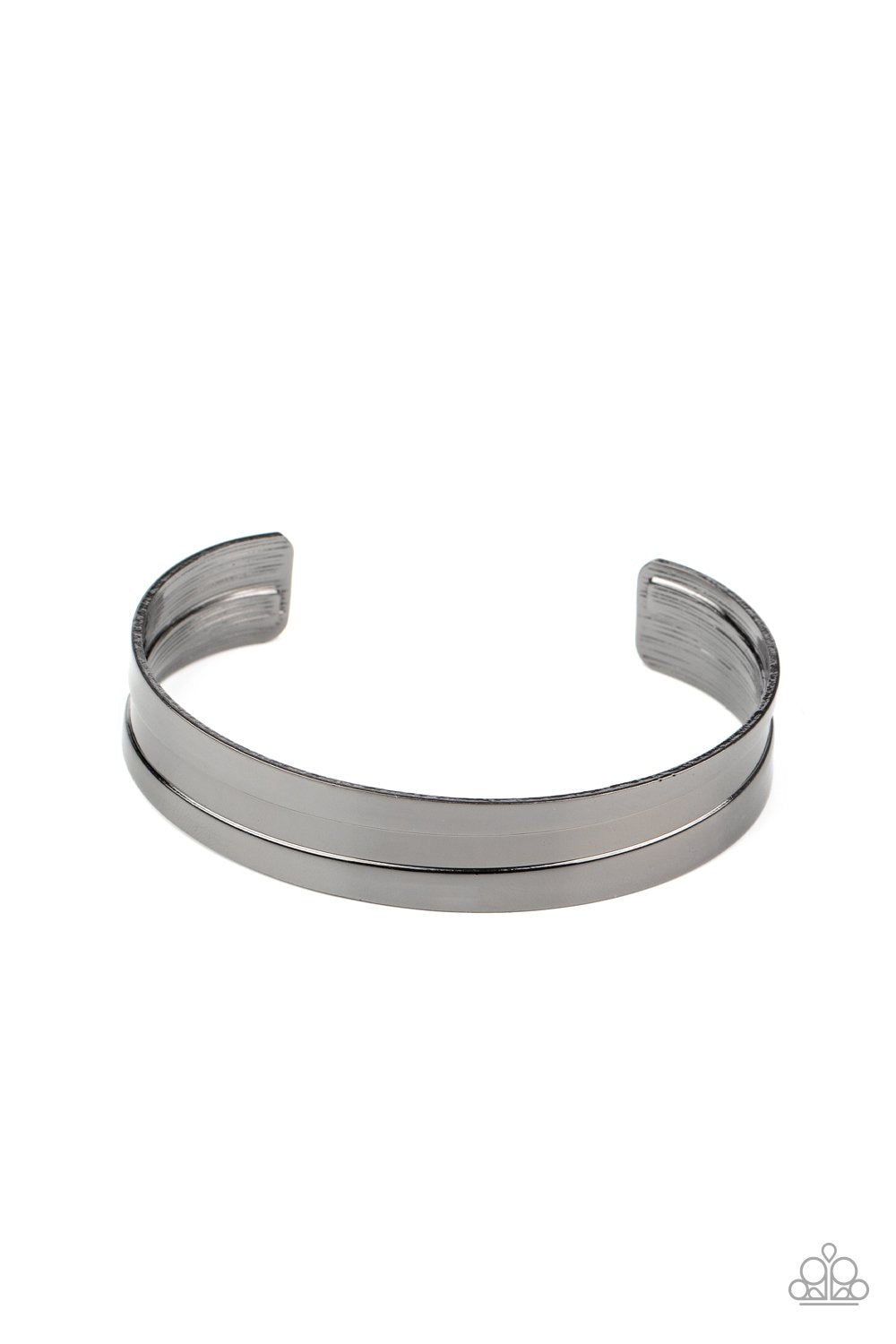 Imprinted in a sleek linear texture, a glistening gunmetal frame curls around the wrist, creating a bold industrial style cuff. Sold as one individual bracelet.