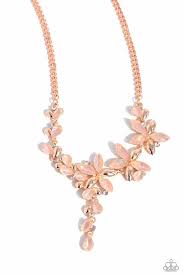 A shiny copper chain gives way to a collection of opalescent peachy marquise-cut rhinestones and shiny copper petals that bloom into a feminine display of flowers. White rhinestones in shiny copper fittings are interspersed along the elongated display for additional shimmer. Features an adjustable clasp closure. Sold as one individual necklace. Includes one pair of matching earrings.