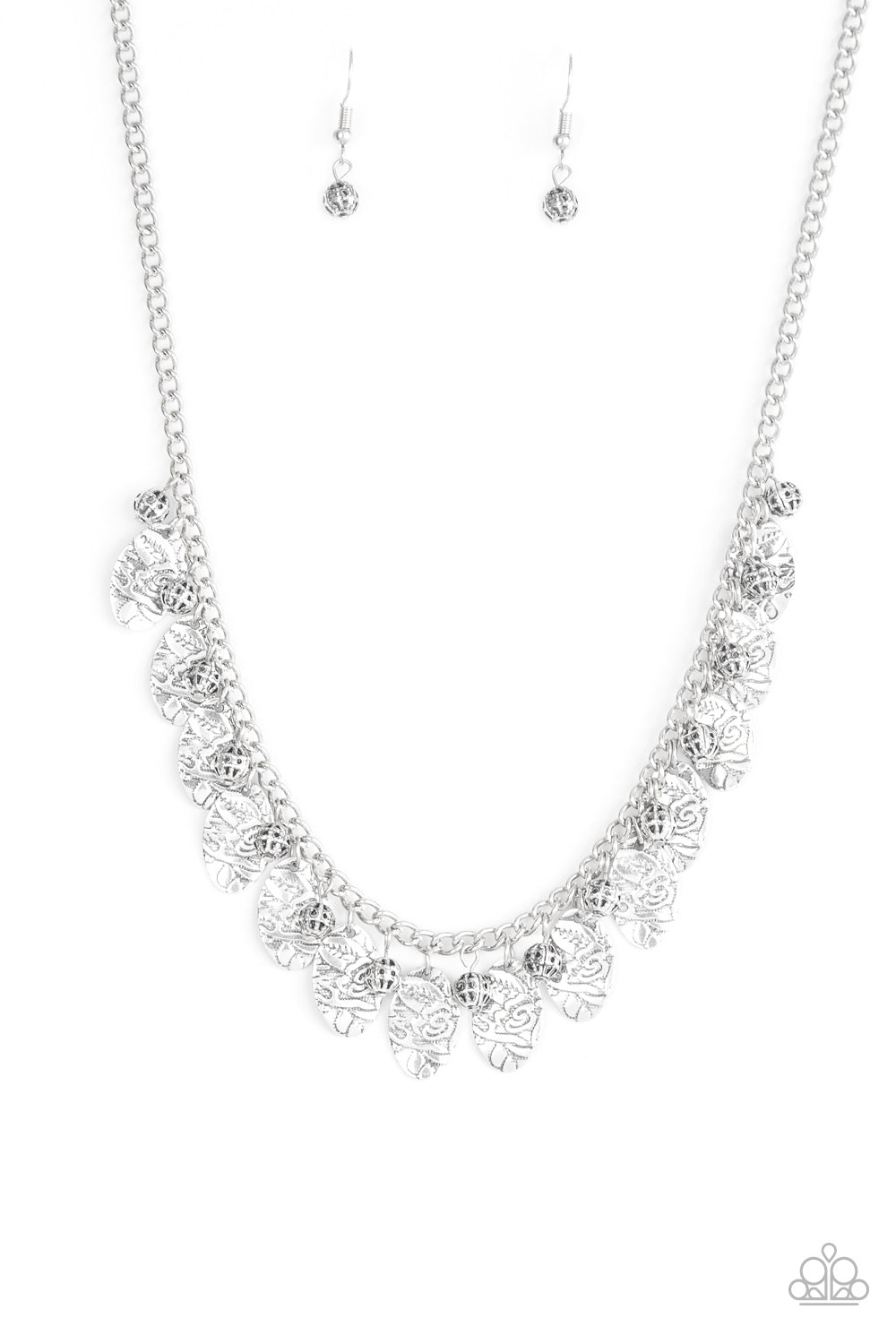 Brushed in an antiqued finish, floral embossed silver frames swing from a silver chain. Infused with ornate silver beads, the whimsical fringe falls just below the collar for a vintage inspired look. Features an adjustable clasp closure. Sold as one individual necklace. Includes one pair of matching earrings.