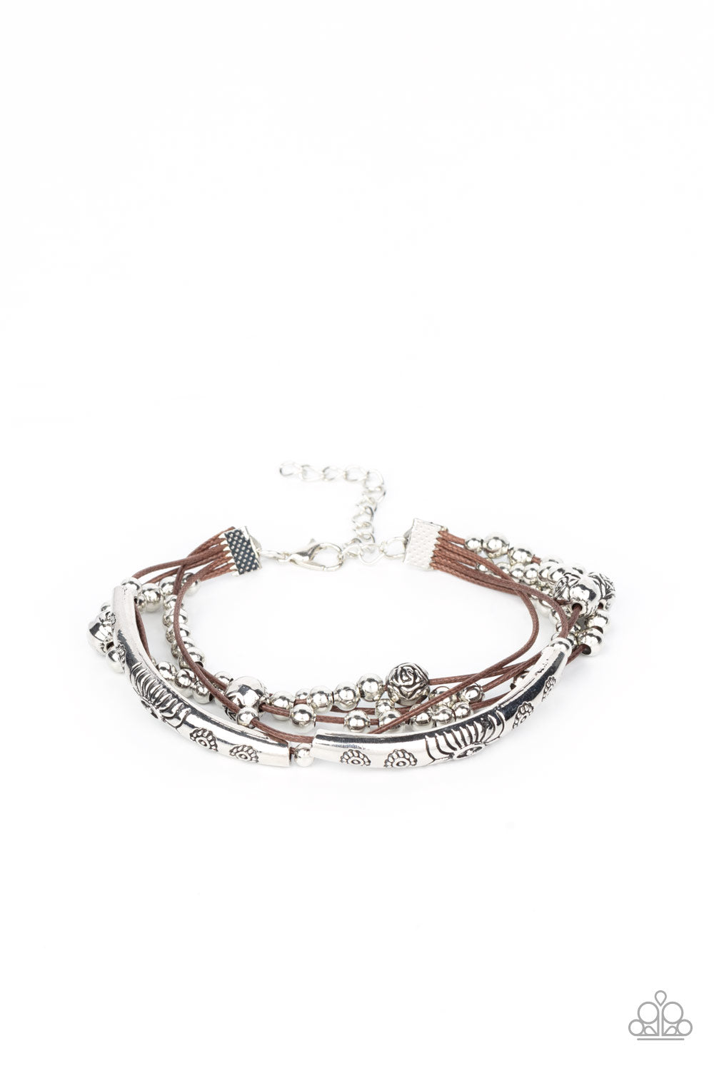 A whimsical collection of classic silver beads, floral stamped silver bars, and silver floral beads glide along layers of shiny brown cording, creating noisemaking layers around the wrist. Features an adjustable clasp closure.
Sold as one individual bracelet.