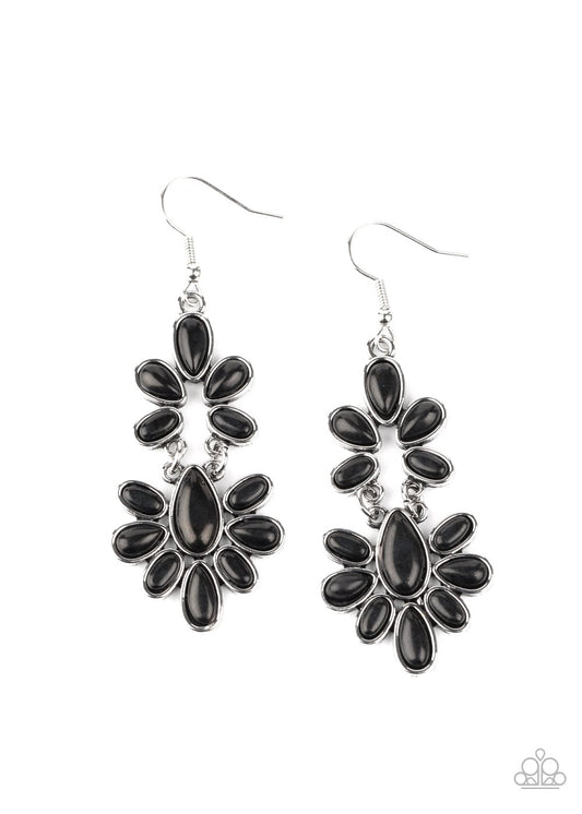 Encased in sleek silver frames, earthy black stone teardrop frames delicately link into a wildly wonderfully floral pattern. Earring attaches to a standard fishhook fitting.  Sold as one pair of earrings.