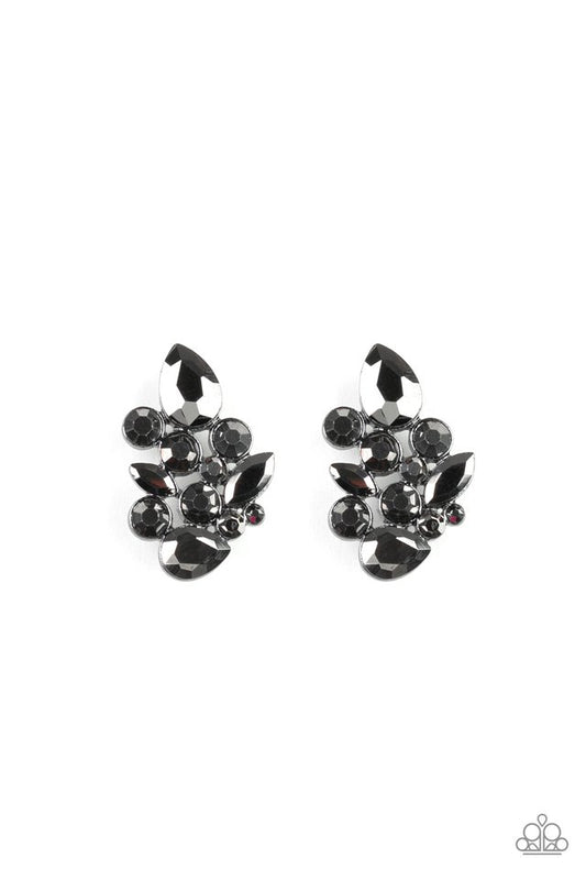 Featuring an array of round, teardrop, and marquise style cuts, a collision of hematite rhinestones explode into a blinding frame. Earring attaches to a standard post fitting.  Sold as one pair of post earrings.