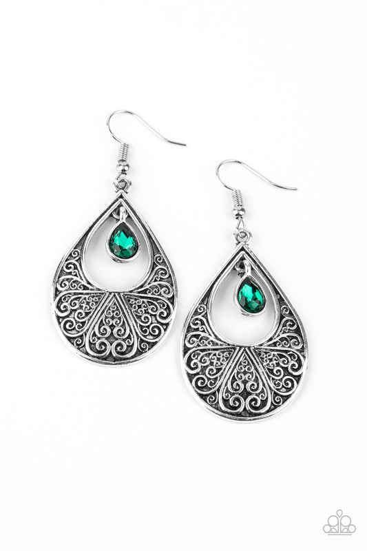 A glassy green rhinestone swings from the top of an airy silver teardrop frame embossed with heart-shaped filigree, creating a whimsical lure. Earring attaches to a standard fishhook fitting.  Sold as one pair of earrings.