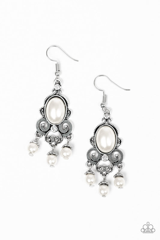 Dotted silver filigree spins around a pearly white bead and dainty white rhinestones, coalescing into a regal frame. A pearly fringe swings from the bottom of the frame for a refined finish. Earring attaches to a standard fishhook fitting.  Sold as one pair of earrings.