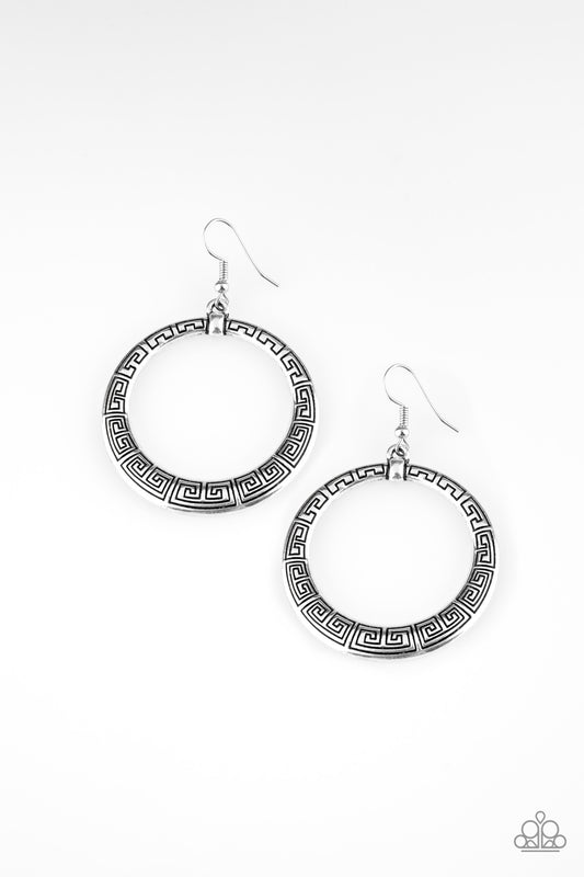 Brushed in an antiqued shimmer, a glistening silver hoop is stamped in dizzying patterns for a tribal inspired look. Earring attaches to a standard fishhook fitting.  Sold as one pair of earrings.