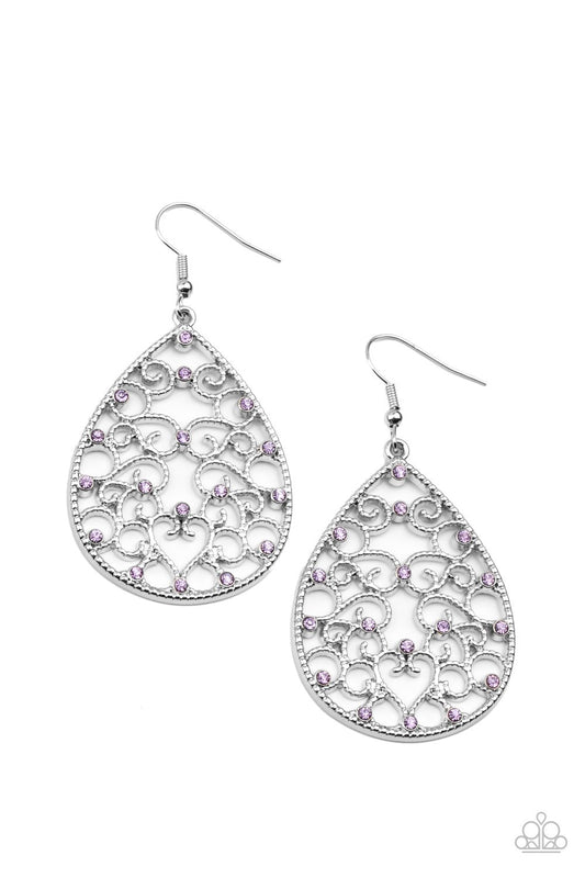 Dotted with dainty purple rhinestones, studded silver filigree vines across the front of a silver teardrop frame for an enchanting look. Earring attaches to a standard fishhook fitting.  Sold as one pair of earrings.