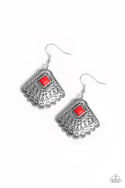 Stamped in tribal inspired patterns, a shimmery silver frames fan out from the bottom of a square fiery red stone for a seasonal flair. Earring attaches to a standard fishhook fitting.  Sold as one pair of earrings.