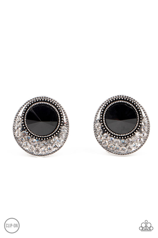 Dotted with an oversized black gem, the flared bottom of a studded silver frame is encrusted in row after row of glassy white rhinestones for a refined flair. Earring attaches to a standard clip-on fitting.  Sold as one pair of clip-on earrings.