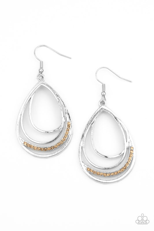 A row of golden topaz rhinestones is encrusted along the bottom of an overlapping silver teardrop frame, creating a glamorous glow. Earring attaches to a standard fishhook fitting.  Sold as one pair of earrings.