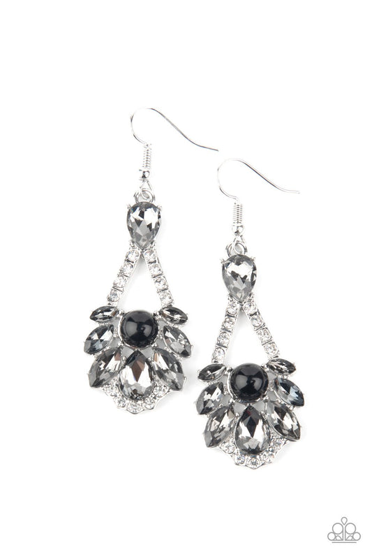A sparkly series of marquise and teardrop smoky rhinestones embellish the front of a white rhinestone encrusted silver frame. A dainty black bead adorns the center, adding a splash of vintage refinement. Earring attaches to a standard fishhook fitting.  Sold as one pair of earrings.