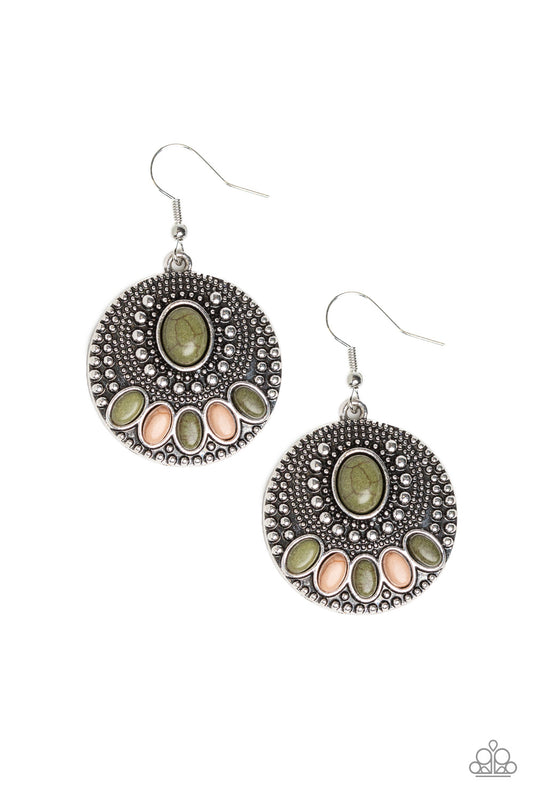 A collection of earthy green and brown stones decorate the front of a round silver frame radiating with shiny silver studs for a seasonal flair. Earring attaches to a standard fishhook fitting.  Sold as one pair of earrings.