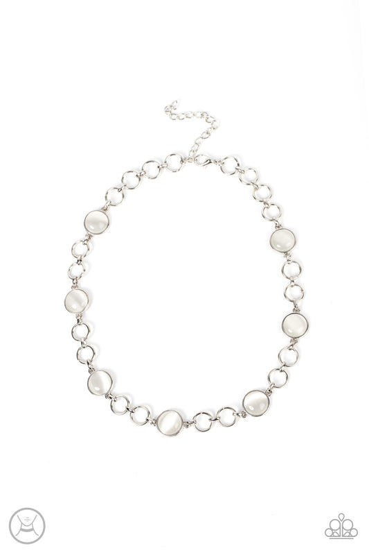 Pairs of silver hoops and white cat's eye dotted silver frames delicately link around the neck, creating a dreamy glow. Features an adjustable clasp closure.  Sold as one individual choker necklace. Includes one pair of matching earrings.