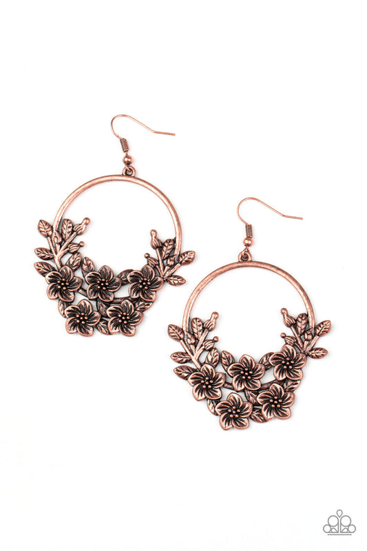 Leafy floral frames climb the bottom of an antiqued copper hoop, creating a whimsical frame. Earring attaches to a standard fishhook fitting.  Sold as one pair of earrings.
