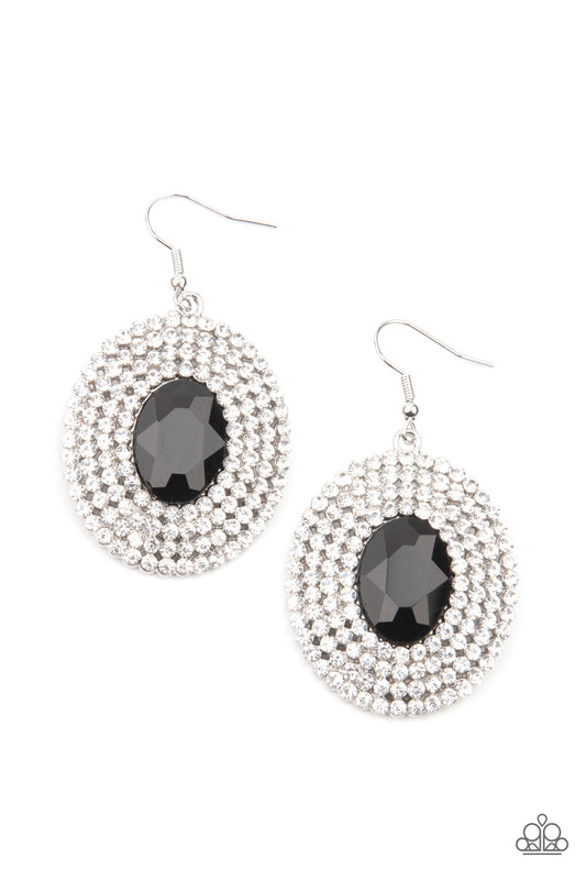 A black oval gem is pressed into the center of ring after ring of glassy white rhinestones, radiating out into a glamorously glittering centerpiece. Earring attaches to a standard fishhook fitting.  Sold as one pair of earrings.