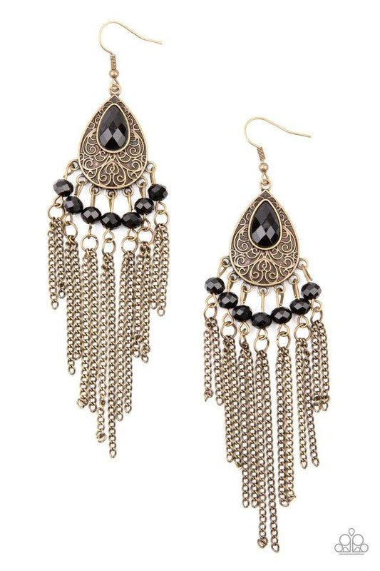 Dotted with glittery black rhinestones, antiqued brass chains stream from the bottom of a brass filigree embossed teardrop, creating a whimsical fringe. A teardrop black rhinestone dots the frame for a dazzling finish. Earring attaches to a standard fishhook fitting.  Sold as one pair of earrings.