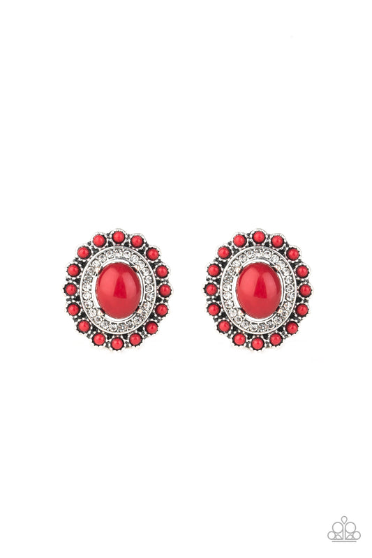 A shiny red bead dots the center of a frilly flower frame radiating with a ring of glassy white rhinestones for a colorful refinement. Earring attaches to a standard post fitting.  Sold as one pair of post earrings.