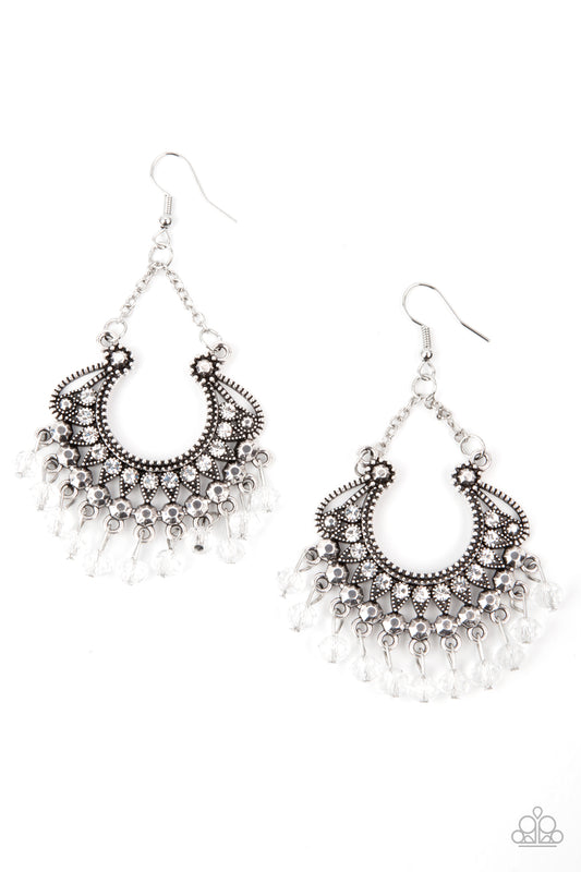 White rhinestone dotted petals fan out into a studded scalloped frame. Glittery white crystal-like beads swing from the bottom of a decorative silver frame, creating a glamorous fringe. Earring attaches to a standard fishhook fitting.  Sold as one pair of earrings.