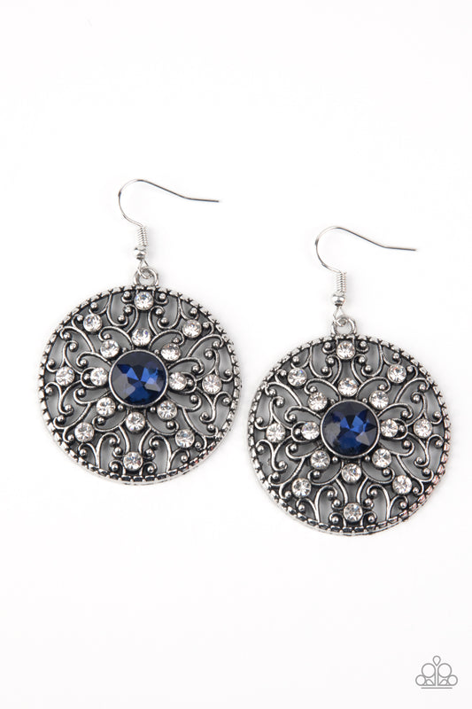 Dotted in glassy white rhinestones, a backdrop of studded silver vine-like filigree climbs a circular frame. An oversized blue rhinestone embellishes the center for a whimsical finish. Earring attaches to a standard fishhook fitting.

Sold as one pair of earrings.