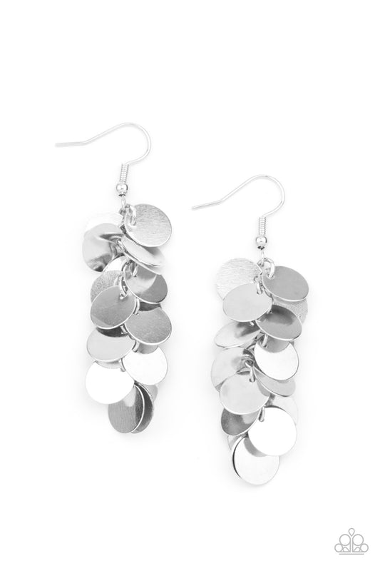 A shimmery collection of dainty silver discs trickle along a dainty silver chain, creating a clustered tassel. Earring attaches to a standard fishhook fitting.  Sold as one pair of earrings.