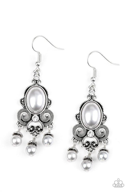 Dotted silver filigree spins around a pearly silver bead and dainty white rhinestones, coalescing into a regal frame. A pearly fringe swings from the bottom of the frame for a refined finish. Earring attaches to a standard fishhook fitting.

Sold as one pair of earrings.