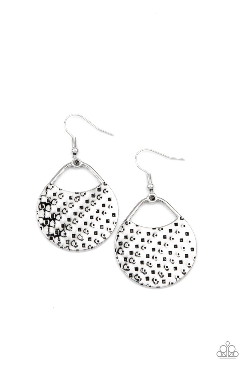 The front of a uniquely shaped silver frame is stamped and hammered in slanting rows of square and dotted patterns for a one-of-a-kind look. Earring attaches to a standard fishhook fitting.  Sold as one pair of earrings.