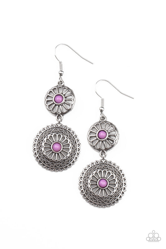 Dainty purple beads adorn the centers of floral patterned silver frames that link into a whimsical lure. Earring attaches to a standard fishhook fitting.  Sold as one pair of earrings.