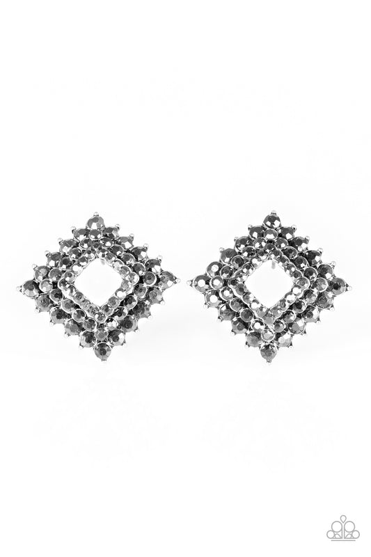 Gradually increasing in size, glittery hematite rhinestones are encrusted along three stacking gunmetal frames for a regal look. The square frames slightly curve in towards the ear for an edgy finish. Earring attaches to a standard post fitting.  Sold as one pair of post earrings.