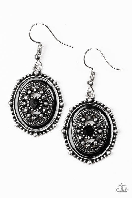 Painted in a shiny black finish, a studded silver frame has been encrusted in glassy black and hematite rhinestones for a refined finish. Earring attaches to a standard fishhook fitting.  Sold as one pair of earrings.