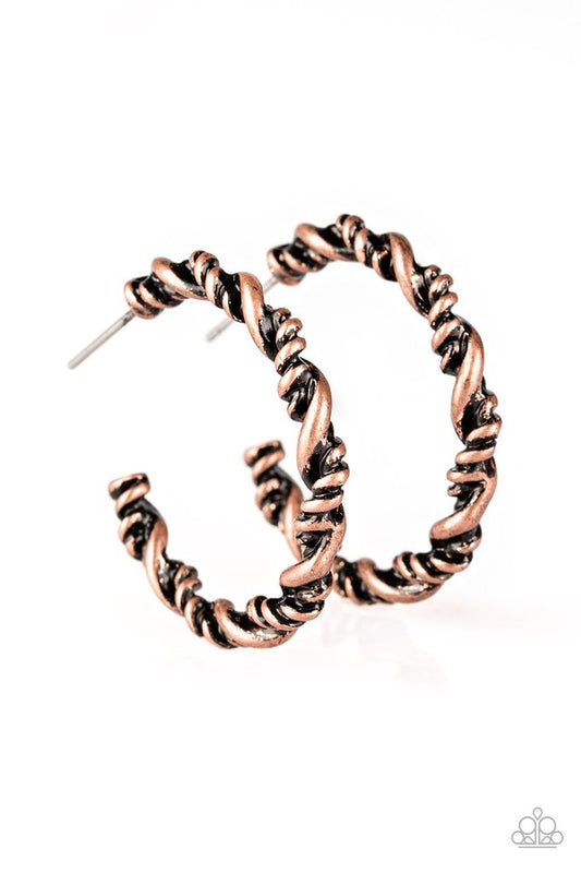 Featuring smooth and serrated textures, glistening copper ribbons twist into a shimmery copper hoop for a tribal inspired look. Earring attaches to a standard post fitting. Hoop measures 1" in diameter.  Sold as one pair of hoop earrings.