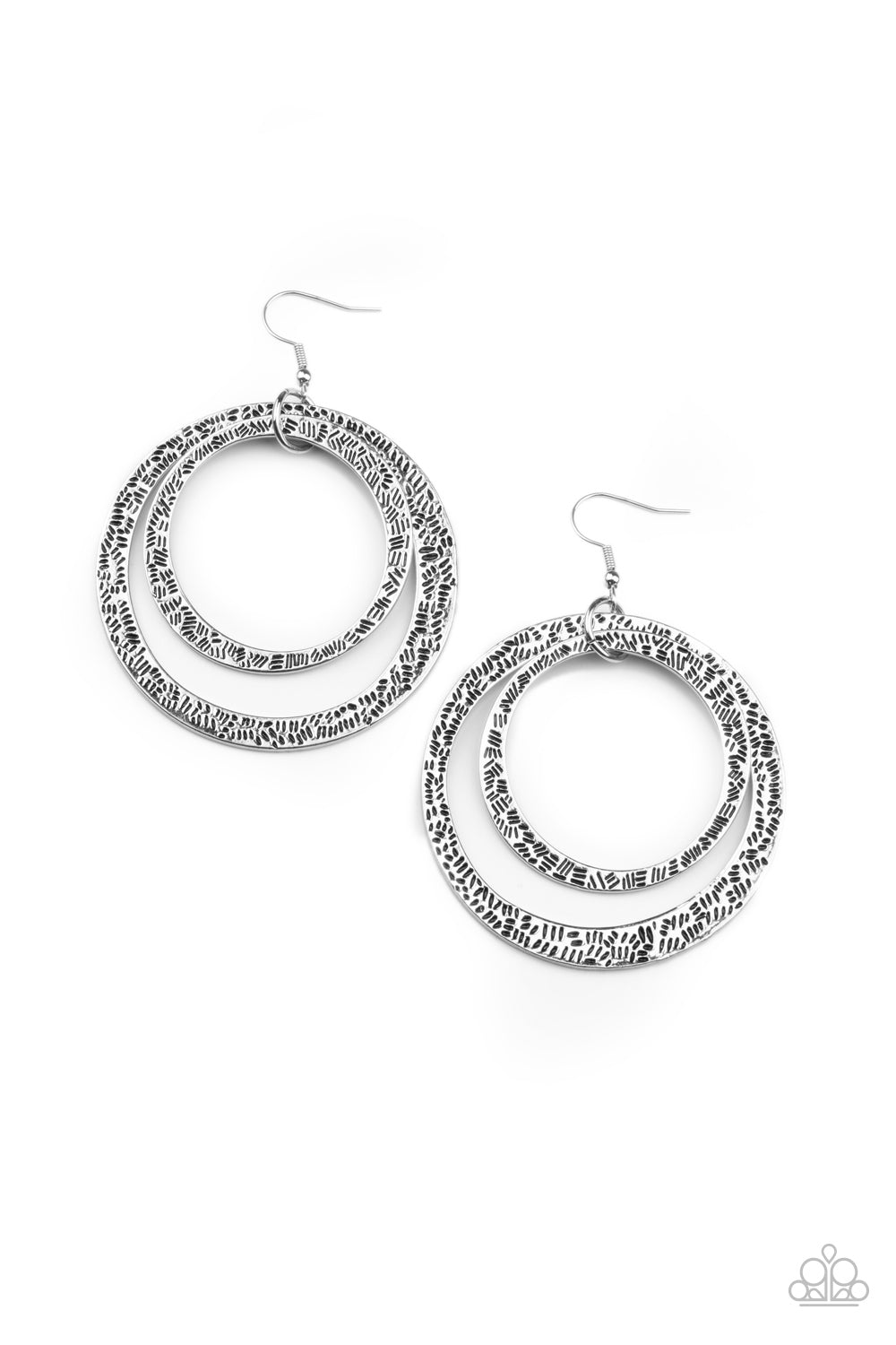Stamped tactile linear patterns, two asymmetrical silver rings link into a rustic hoop. Earring attaches to a standard fishhook fitting.  Sold as one pair of earrings.
