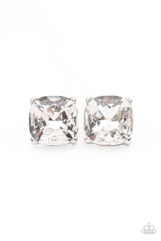 A dramatically oversized white gem is nestled atop a pronged silver frame, creating a jaw-dropping dazzle. Earring attaches to a standard post fitting.  Sold as one pair of post earrings.