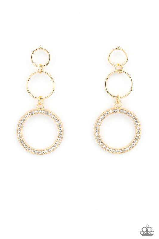 Two dainty gold rings give way to a white rhinestone encrusted gold hoop, adding a timeless twist to the dazzling display. Earring attaches to a standard post fitting.  Sold as one pair of post earrings.