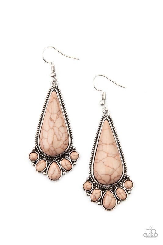 A dainty collection of round, oval, and teardrop brown stones fan out from the bottom of an oversized teardrop brown stone frame for a simple seasonal flair. Earring attaches to a standard fishhook fitting.

Sold as one pair of earrings.