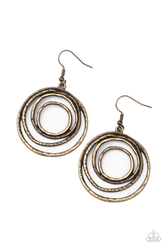 Brushed in an antiqued shimmer, hammered brass wire coils into a dizzying frame for an edgy industrial look. Earring attaches to a standard fishhook fitting.  Sold as one pair of earrings.