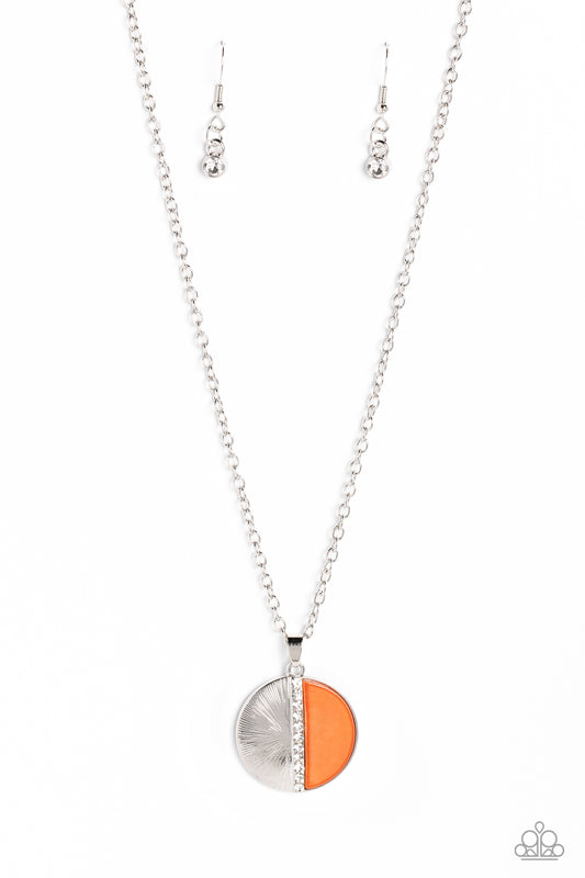 Embossed in radiant linear textures, a half-circle silver frame is nestled next to a half-circle coral shell for a colorful finish. White rhinestones dot down the center of the pendant for a spritz of glitz down the neckline. Features an adjustable clasp closure.  Sold as one individual necklace. Includes one pair of matching earrings.