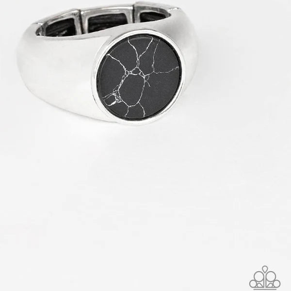 Featuring a faux marble finish, a flat black stone is pressed into the center of a classic silver band. Features a stretchy band for a flexible fit.  Sold as one individual ring.