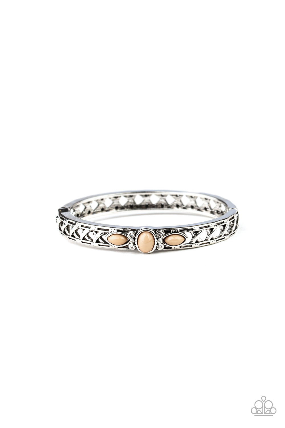Dotted with a Lark beaded and glassy rhinestones encrusted centerpiece, a crisscrossing silver bangle-like cuff slides along the wrist for a whimsical look. Features a hinged closure.  Sold as one individual bracelet.