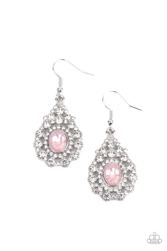 Bordered in a ring of dainty white rhinestones, an opalescent pink gem adorns the center of a teardrop frame radiating with glassy white rhinestones for an ethereally elegant look. Earring attaches to a standard fishhook fitting.  Sold as one pair of earrings.