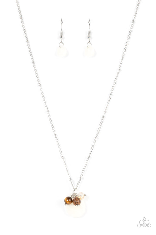 An earthy cluster of wooden, crystal-like, and tiger's eye stone beads joins an enchanting quartz-like teardrop at the bottom of a dainty silver satellite chain, resulting in a tranquil pendant below the collar. Features an adjustable clasp closure.  Sold as one individual necklace. Includes one pair of matching earrings.