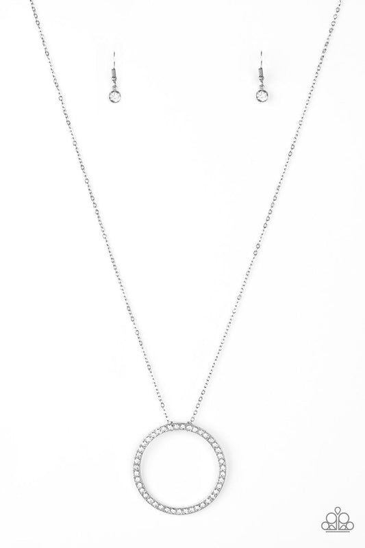 Encrusted in glittery white rhinestones, a dramatic silver hoop swings from the bottom of a lengthened silver chain for a refined look. Features an adjustable clasp closure.  Sold as one individual necklace. Includes one pair of matching earrings.