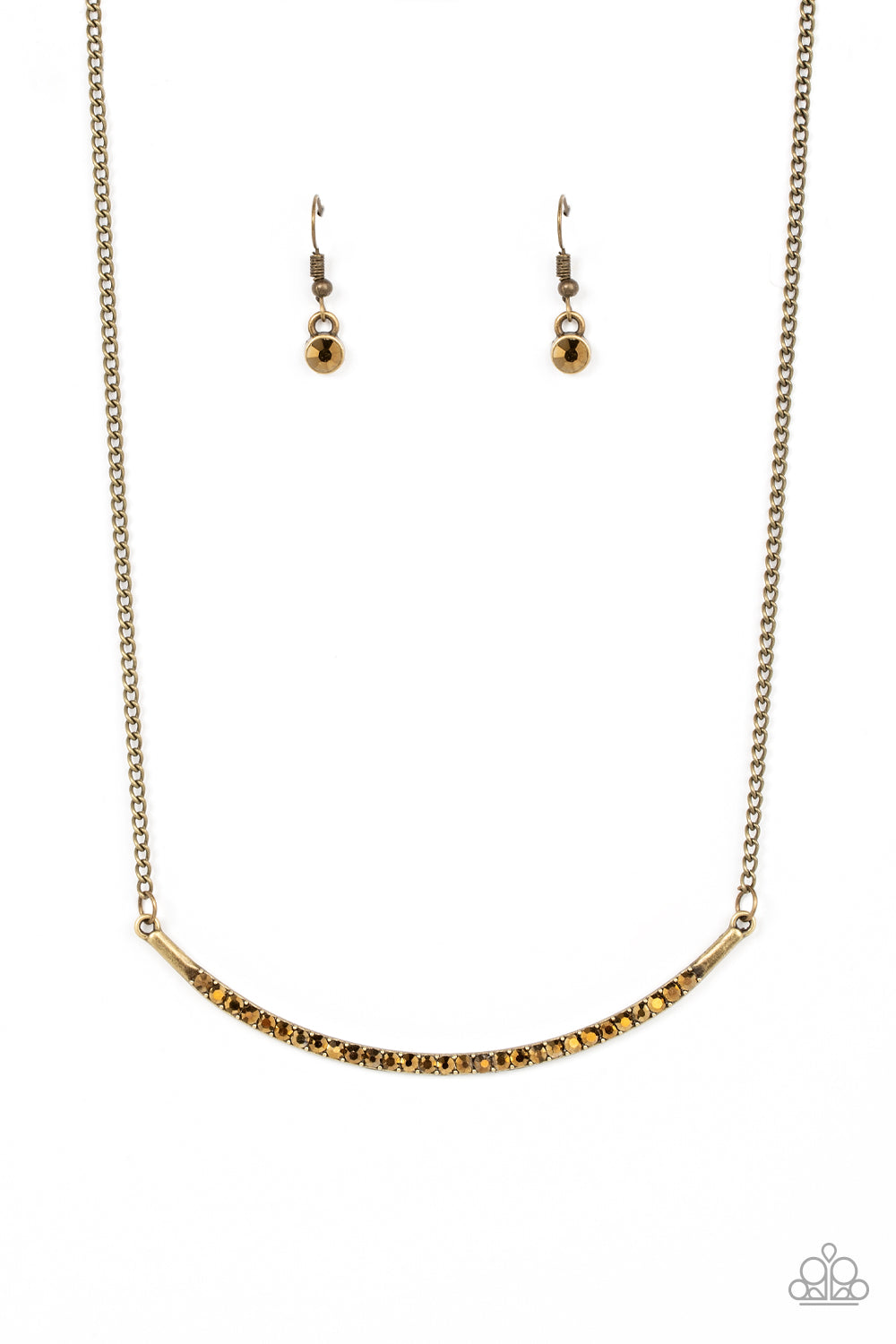 Encrusted in glitzy aurum rhinestones, a curved brass bar bows below the collar for a smoldering style. Features an adjustable clasp closure.  Sold as one individual necklace. Includes one pair of matching earrings.
