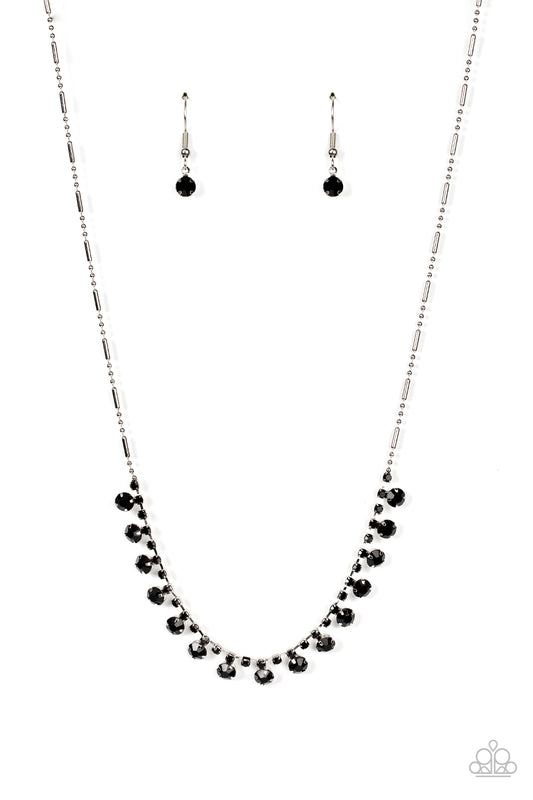 A glittery row of glassy black rhinestones dances from the bottom of a dainty strand of black rhinestones below the collar, creating a mic-dropping dazzle. Features an adjustable clasp closure.  Sold as one individual necklace. Includes one pair of matching earrings.