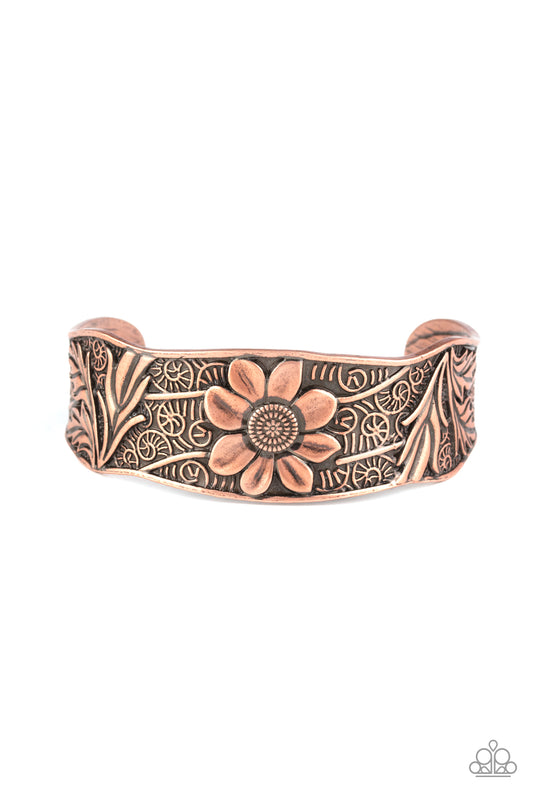 The front of an asymmetrical copper cuff is stamped and embossed in lacy vines and a leafy floral pattern for a whimsical fashion.  Sold as one individual bracelet.