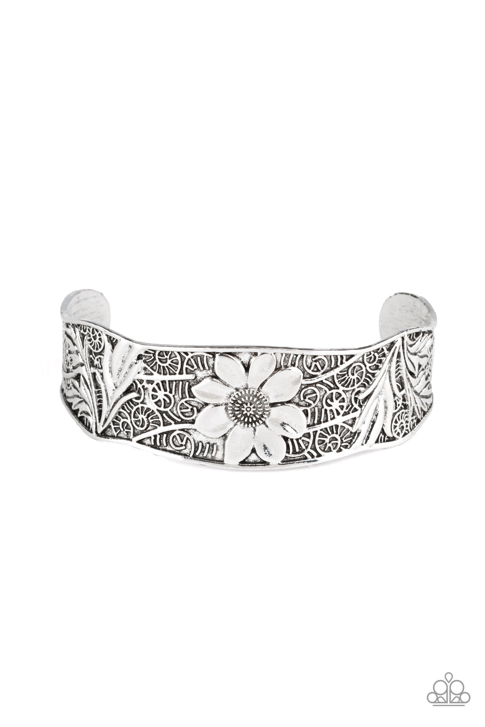 The front of an asymmetrical silver cuff is stamped and embossed in lacy vines and a leafy floral pattern for a whimsical fashion.  Sold as one individual bracelet.