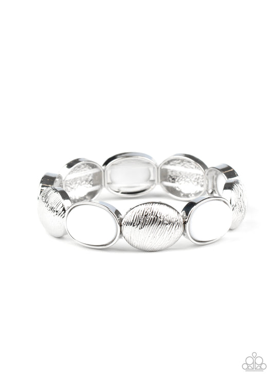 Bubbly white beaded frames and textured silver caps alternate along stretchy bands around the wrist, adding a colorful pop of color.

Sold as one individual bracelet.