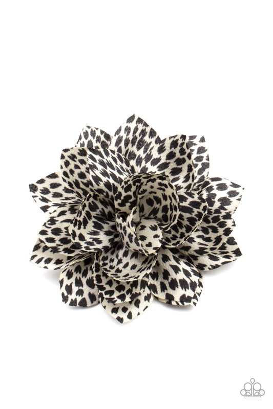 Spotted in a black and white animal inspired print, satin petals layers into a wild blossom. Features a standard hair clip on the back.  Sold as one individual hair clip.