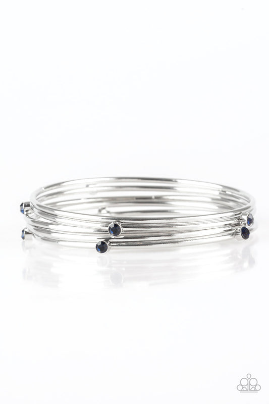 Three shiny silver and two blue rhinestone-encrusted bangles stack across the wrist for a refined look.  Sold as one set of five bracelets.
