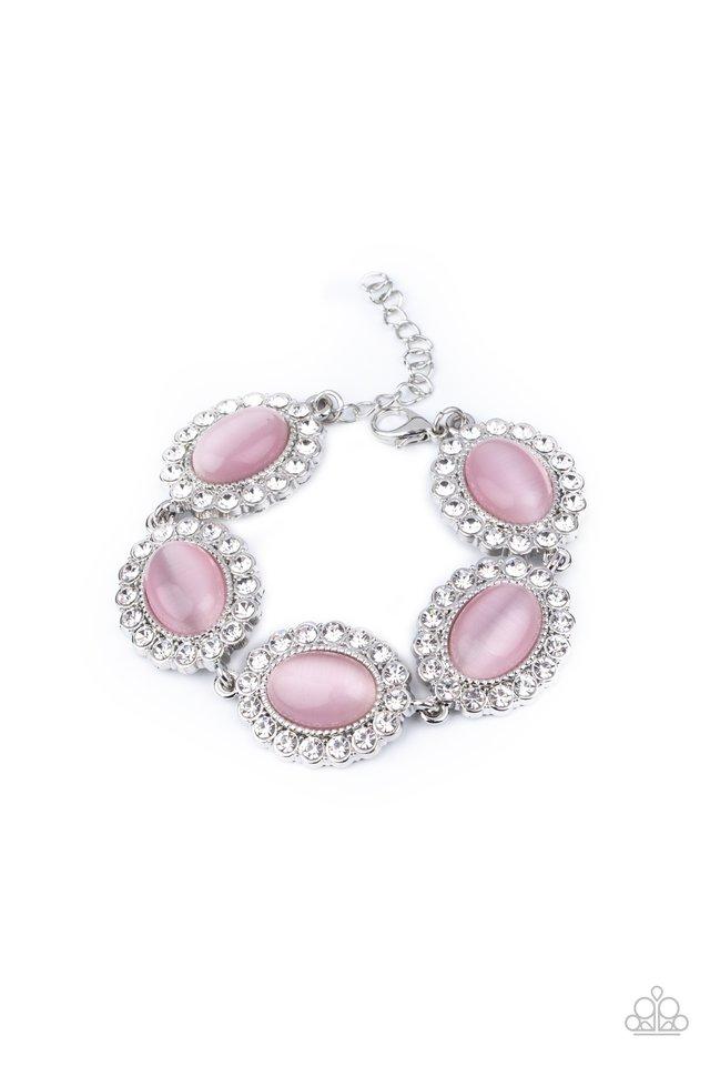 Dotted with glowing Pink Nougat cat's eye stone centers, glassy white rhinestone encrusted frames glamorously link around the wrist in a sparkly statement-making fashion. Features an adjustable clasp closure.  Sold as one individual bracelet.